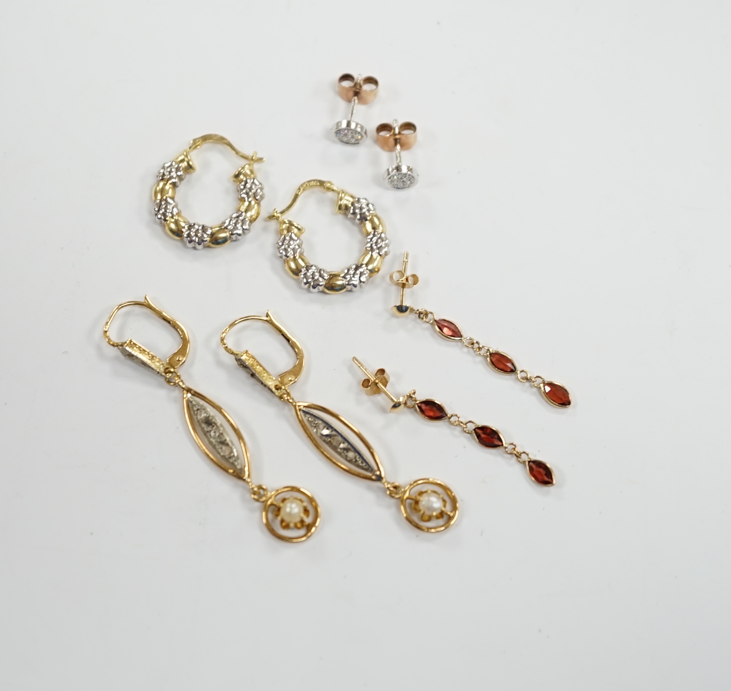 A pair of French 18k and cultured pearl drop earrings, 45mm and three other pairs to include 14k and diamond cluster, 9ct and garnet drop and two colour 10k.